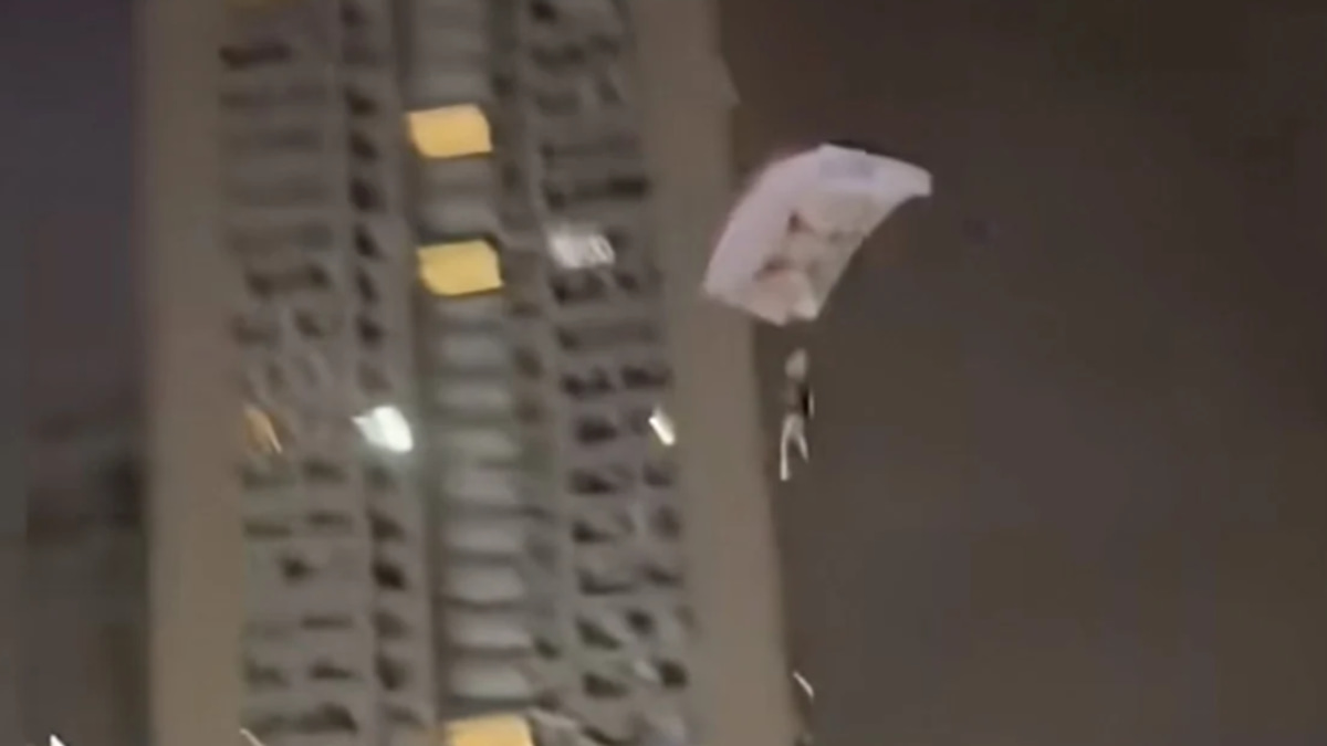 Chinese Man Detained After Illegal Rooftop Skydive Stunt for Social Media