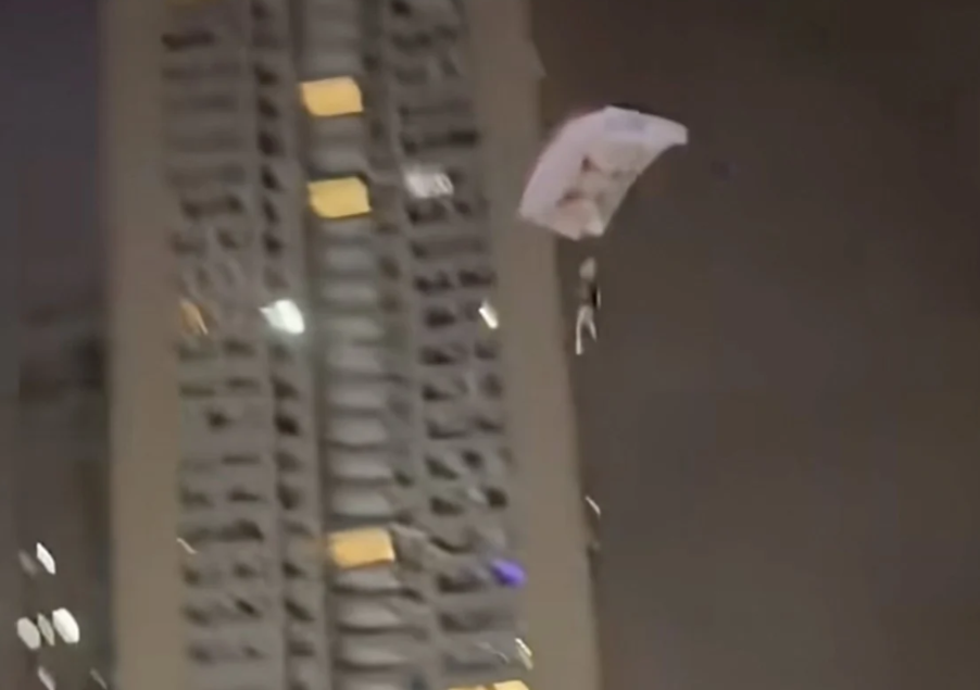 Chinese Man Detained After Illegal Rooftop Skydive Stunt for Social Media