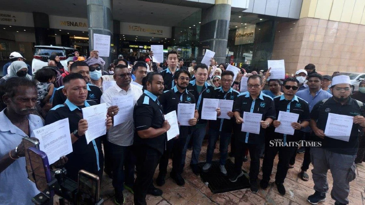 Victims' Group Pushes Police to Speed Up Investigations Into 18 Suspected Investment Scam Operations