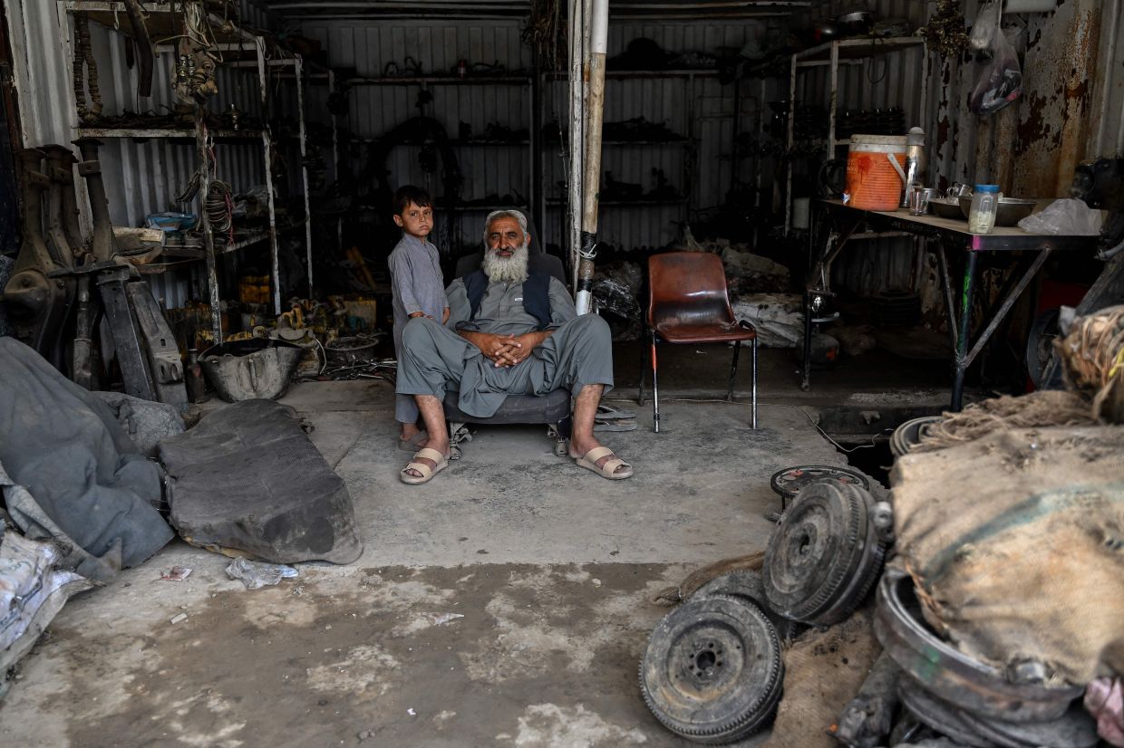 Afghanistan's vital car trade grinds to halt as geopolitical crises choke supply routes
