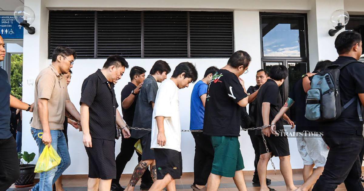 Nine Chinese nationals appear in court over alleged romance fraud network