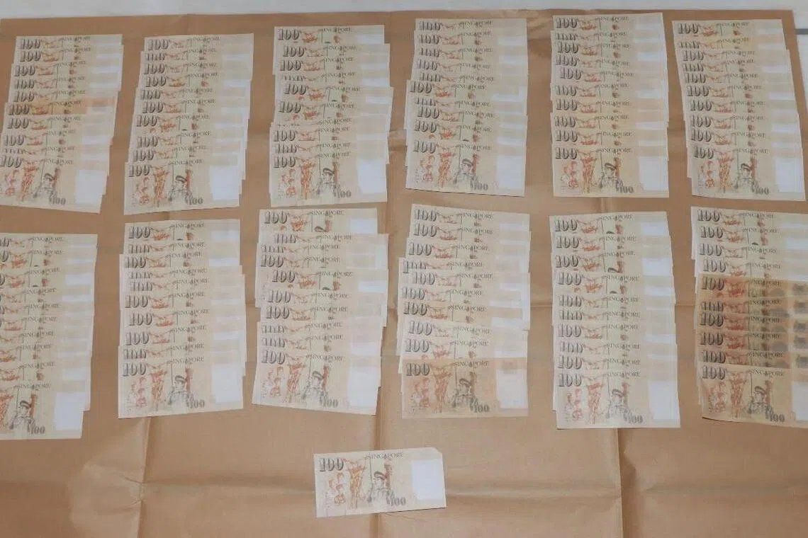 Two Chinese nationals face charges for counterfeiting Singapore currency