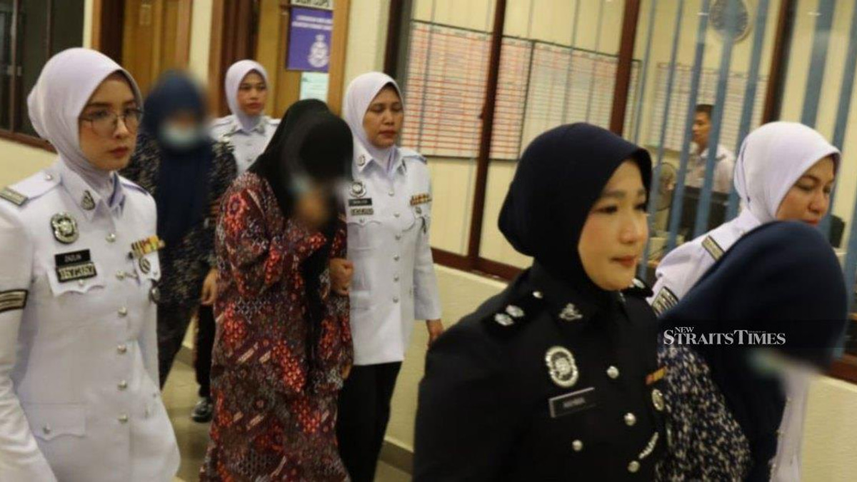 Three women charged for dangerous 'Superman' motorcycle stunts on Kuantan highway